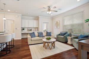 Cozy living rooms with plenty of space provide comfort for residents at The Victoria senior living apartments.